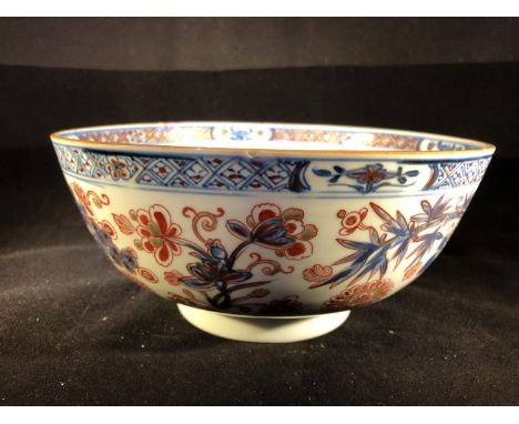 A Chinese blue and white porcelain small puch bowl, later over decorated in Europe in iron red and gilt, 22.5cm diam 