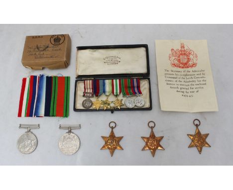 A WW2 medal group comprising 1939 Star, Atlantic Star, Italy Star, War Medal and Defence medal, together with the correspondi