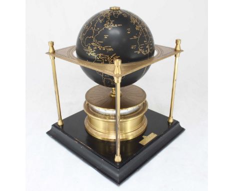 A Royal Geographical Society World Clock, with movement by Arthur Imhof S.A. The black terrestrial globe with gilt markings a