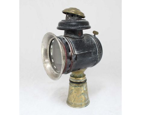 A Victorian brass and metal coaching lamp with single round glass panel to front, 31cm high