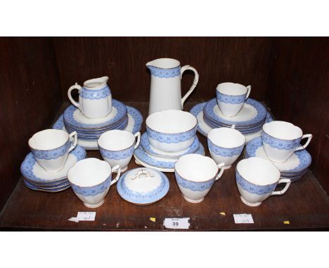 SECTION 39. A Royal Worcester blue, white and gilt decorated tea set comprising of thirty pieces, including jugs, teacups and