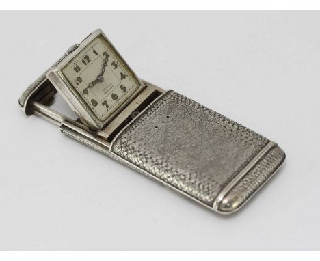 A Texina Impervo Art Deco silver purse watch with three piece sliding spring action case, the dial with coloured Arabic numer