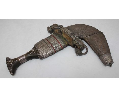 A 19th Century Ottoman Jambiya dagger / Khanjar, with inlaid, horn handle, white metal detailing and in decorative, silver wi