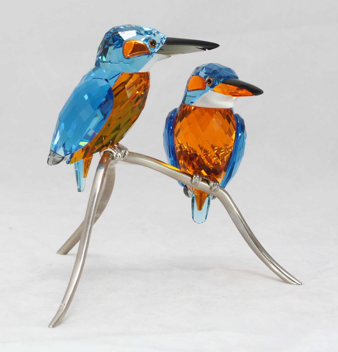 A Swarovski crystal 'Kingfishers blue Turquoise' figure depicting two ...