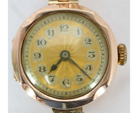 A ladies 1920s 9ct gold wristwatch, with 15-jewel Swiss movement, engine-turned gold dial with Arabic numerals, 25mm circular