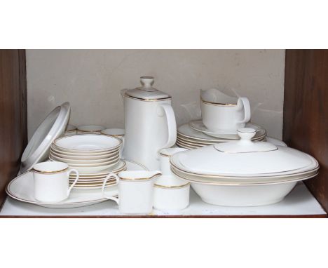 SECTION 13. A Royal Doulton Gold Concord pattern tea and dinner service, including tea cups and pot, dinner plates, two lidde