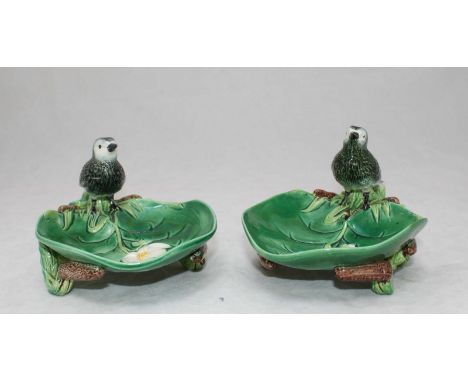 A pair of George Jones Majolica dishes modelled as lily pads with rush supports and birds perched atop, 18cm x 12cm, (one dis