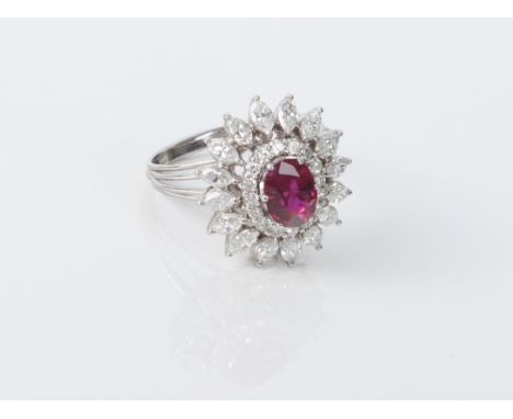 An 18ct gold, ruby and diamond cluster ring.