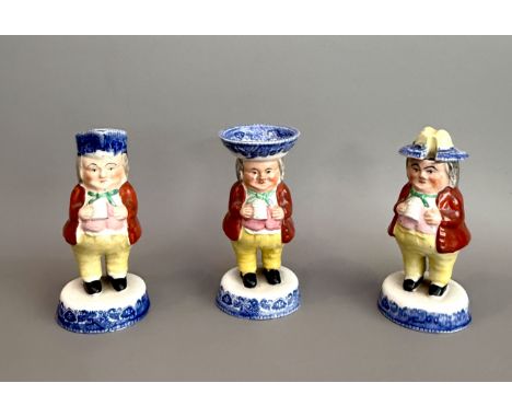 A three piece 19th century Staffordshire toby jug cruet set - 14cm high, the mustard with a glued repair to lid, small chip t