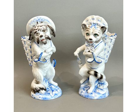 A pair of Continental porcelain anthropomorphic figural cat and dog spill vases - early 20th century, the cat and dog both ca