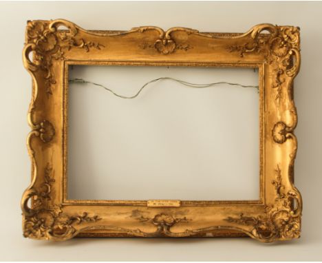 A late 19th century gilt picture frame with title plate inscribed 'In the Highlands - R. Watson', 64 x 82 cm.