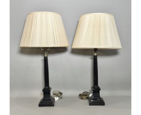 A pair of painted brass column table lamps - first half 20th century, later painted in gloss black, 54.5cm high, with pale go