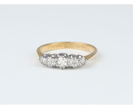 A platinum and 18ct gold five-stone diamond ring, approx 2.8ct, size P/Q