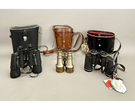 Three pairs of vintage binoculars - comprising a pair of pre-war plated metal and brass field glasses, stamped "X 5 2 7/16", 