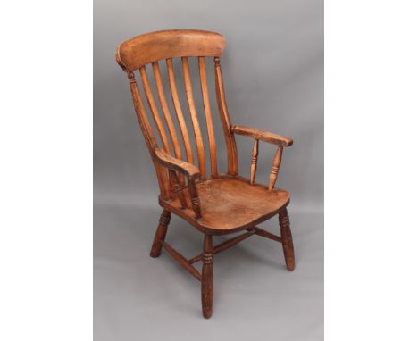 A 19th century beech and elm lathe-back armchair&nbsp; - the saddle seat over shortened legs, 58cm wide, 99cm high.
