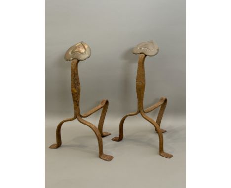 A pair of early 20th century Arts &amp; Crafts style copper and wrought iron fire dogs - the tripod fire dogs with shaped upr