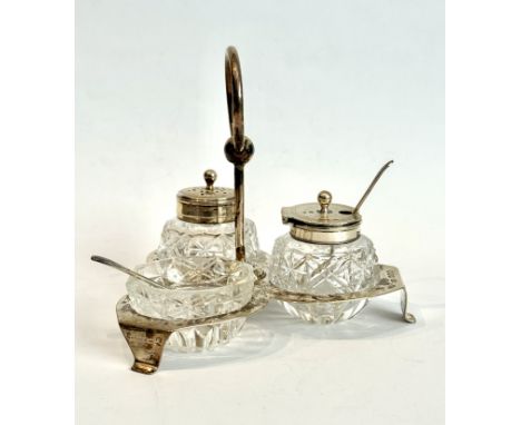 A late-Victorian silver and cut glass cruet stand - Thomas Woolley, Birmingham 1895, of trefoil form with central loop handle