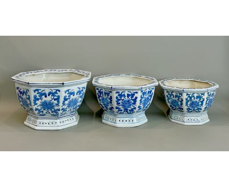 A graduated set of three Chinese blue and white porcelain jardinieres - 20th century, octagonal with flared, pierced bases, p