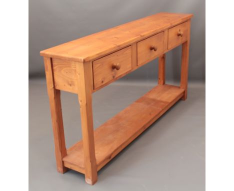 A pine three-drawer console table or dresser base with undertier - (LWH 172 x 34.5 x 90cm)