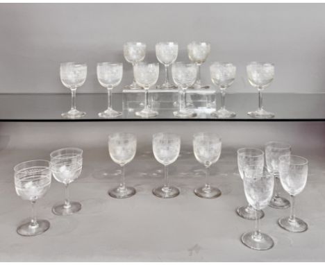 A set of 12 x Edwardian Greek key engraved port or sherry glasses - 12.7cm high; together with a pair of similar glasses, 11.