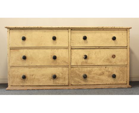 A 19th century painted pine six-drawer country house dresser base - with two banks of three half drawers with ebonised turned