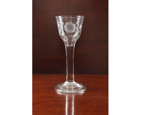 A mid-18th century engraved wine glass - circa 1745, the ogee bowl engraved with a rose and floral sprig, on a plain, slightl