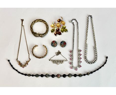Six pieces of vintage costume jewellery - including a 1950s gilt metal and paste brooch in the form of a floral and foliate s