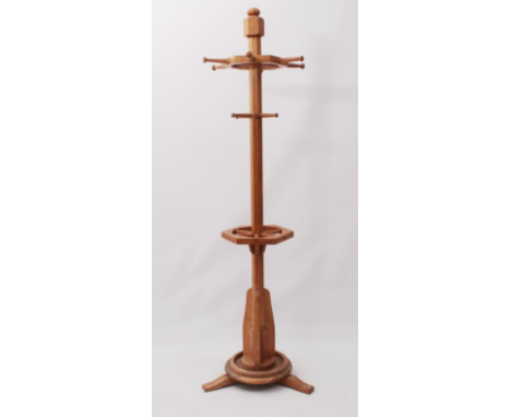 A honey oak coat, hat and stick stand in the Arts &amp; Crafts style - late 20th century, the hexagonal column with a spoked 
