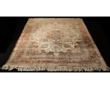 A large Qum-style silk rug - second half 20th century, the central eight-point floral meander on an ivory field with floral d