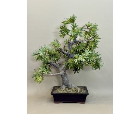 An imitation Bonsai tree - on a black glazed stoneware planter, approx. 65cm high.