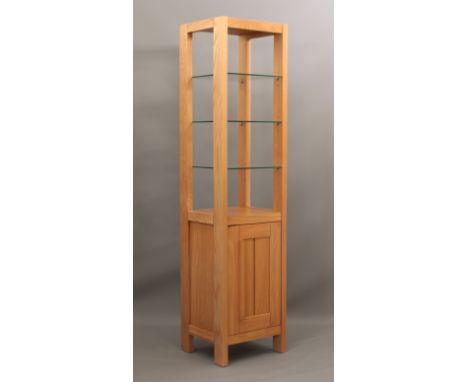 A glass and light oak display stand with lower cupboard - modern, the upper section with three adjustable glass shelves, the 
