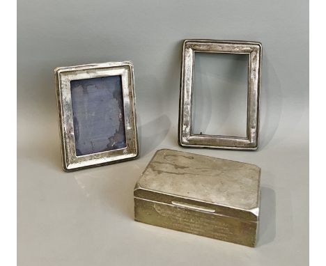 A George VI silver cigarette box - Roberts &amp; Dore Ltd, Birmingham 1940, rectangular with clipped corners to the lid and e