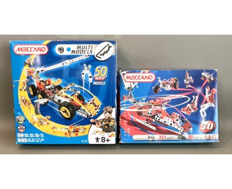 Four modern Meccano construction sets - comprising an 037080 100th Anniversary Special Edition 25 model set (643 parts); an 0