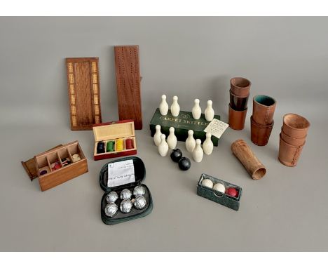 A collection of vintage games and gaming accessories - including two early 20th century cribbage boards; a boxed set of Towse