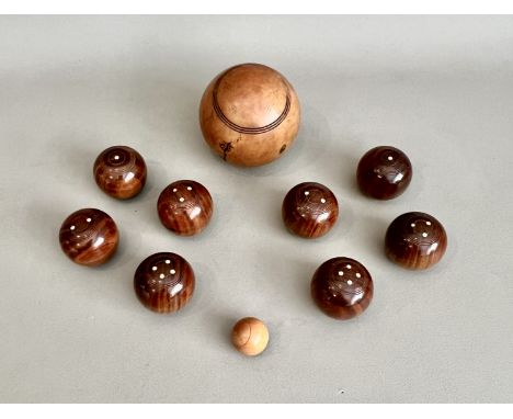A set of eight 19th century turned wooden carpet bowls - 44mm diameter, together with a boxwood jack; and a larger 19th centu