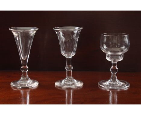 Three small 18th and early 19th century wine glasses - comprising a small 18th century wine with a double ogee bowl on a stem