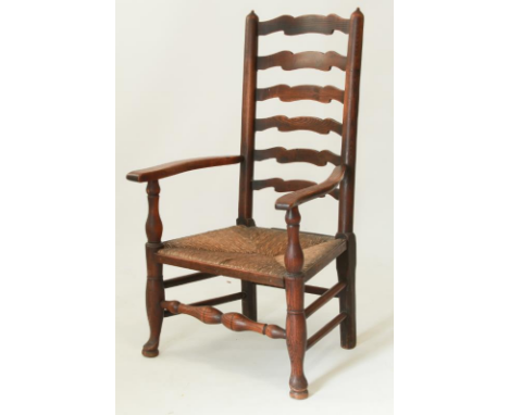 An early 19th&nbsp;century ash and elm ladder back open armchair - the ladder back with six shaped rails on turned uprights, 
