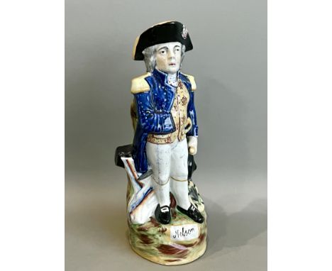 A 19th century Staffordshire pottery commemorative jug modelled as Admiral Lord Nelson - 29cm high.