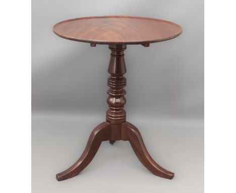 A mid-19th century and later mahogany tilt-top tripod table - the circular dished top on a ring and baluster turned column, r