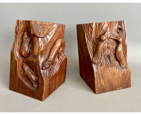 A pair of carved oak bookends in the manner of Mouseman and the Yorkshire Critters - in fumed finish, one carved with a pair 