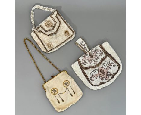Three vintage mid-20th century evening bags - two beaded, one with ivory and pink beads with stylised floral decoration, faux