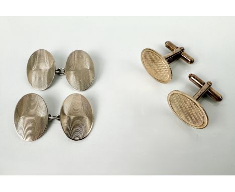 Two pairs of silver cufflinks - oval, with engine turned decoration, one pair in silver gilt, the other pair in 9ct gold and 