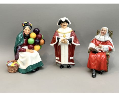Three Royal Doulton figures - comprising HN1315 The Old Balloon Seller; HN2443 The Judge; and HN2280 The Mayor.