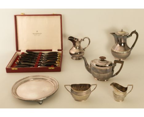 A cased set of steak knives and forks with antler handles together with a small silver cream jug and five pieces of silver pl