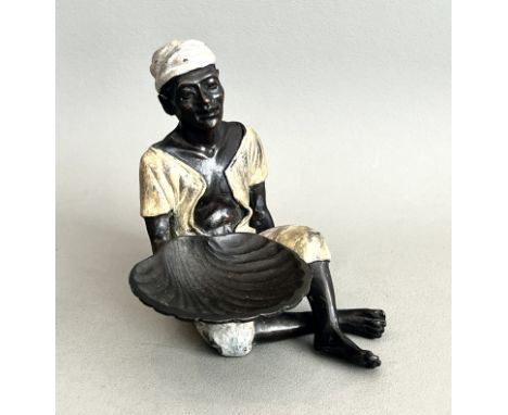 A cold painted bronze figure of a seated north African street vendor - modern, in the early 20th century Austrian style, the 