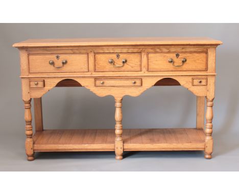 A small light-oak potboard dresser base in the 18th century style - (LWH 140 x 47 x 84cm)