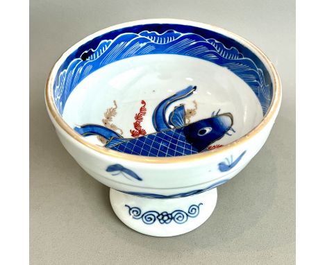 A Japanese porcelain footed bowl, early 20th century - painted with a carp in underglaze blue, iron red and gilt below a band
