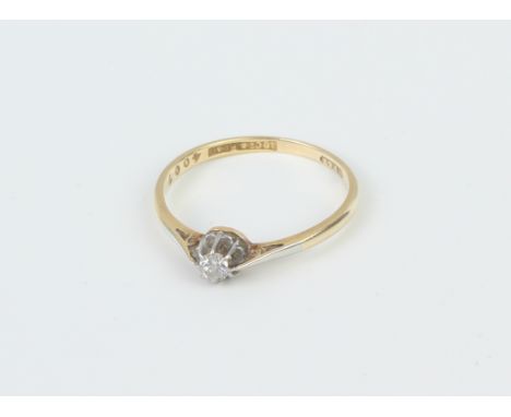 An 18ct gold, platinum and diamond single stone ring - mid-20th century, stamped '18CT &amp; PLAT', with a single old brillia