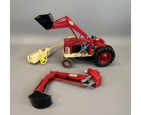 A 1960s Cragstan tinplate toy battery remote control Ford 4000 Industrial Tractor Diesel - 1/10 scale, red and cream with bla