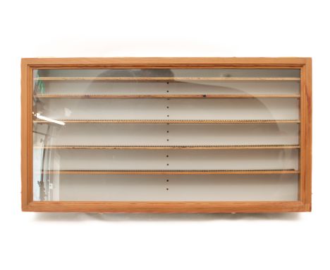 A pine model railway display cabinet - wallhanging and with a fold-up hinged front, five adjustable shelves laid with 00 gaug